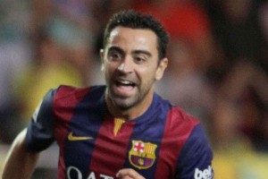 Xavi celebra un gol con el cuadro que dirige Luis Enrique